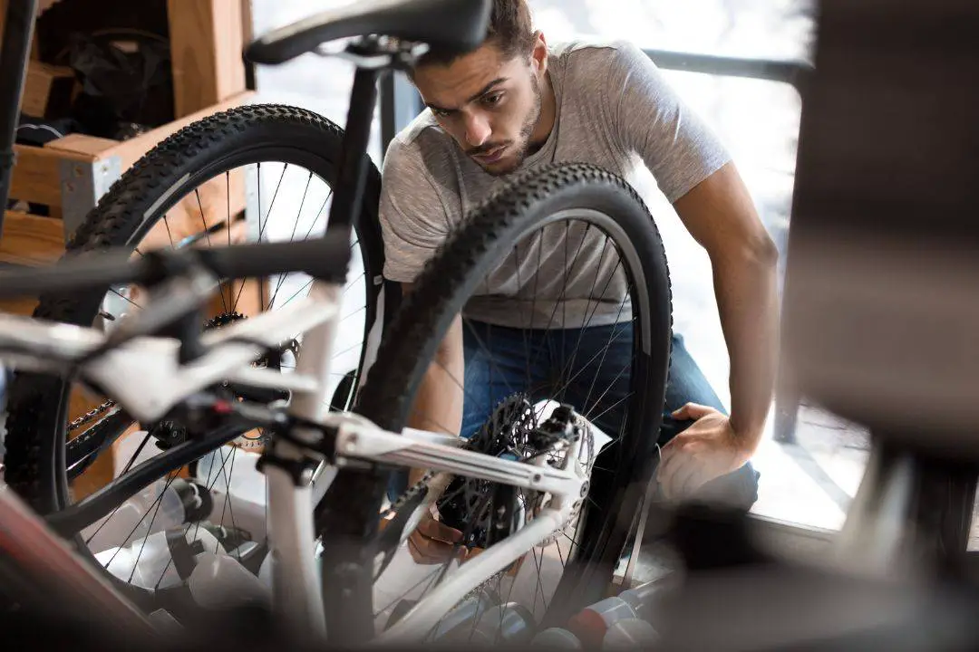  A man is assembling the Frame of a Trike